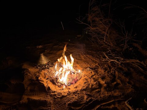 Berber camp fire in the Sahara desert Morocco