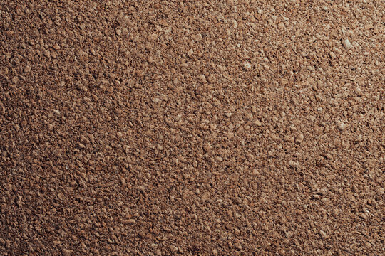 Closeup of organic brown cork board sheet surface. Textured abstract background for eco friendly branding corporate notice board and interior design concepts