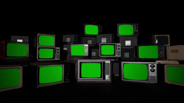 Stack of old vintage retro CRT televisions with green screens in a dark room, ready for chroma key compositing. Perfect for retro, 80s, 90s, nostalgia, media, and broadcast content templates.