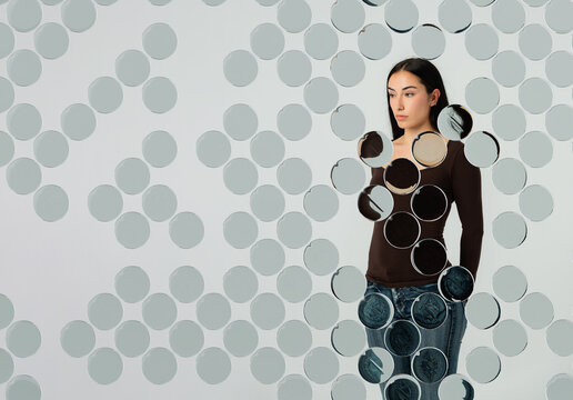 3D circular glass pattern with woman and dot overlay
