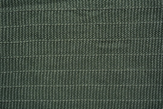 Dark green suiting fabric texture background, forest khaki woven textile surface macro closeup, full frame