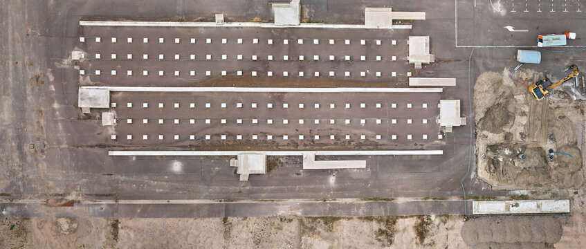 Middenmeer, Netherlands - 15 April 2026: Aerial view of Microsoft Datacenter Campus AMS showing foundations for a container-based battery park and construction machinery.