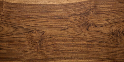 Fototapeta premium A detailed close-up showcases the rich, natural grain and intricate patterns of a dark wood surface, highlighting its organic texture and earthy tones.