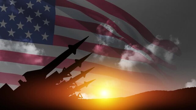 The missiles are aimed at the sky at sunset with USA flag. Bomb, chemical weapons, missile defense, a system of salvo fire.