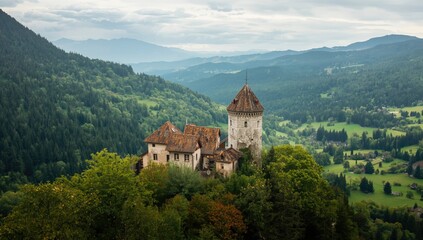 Fototapeta premium Ancient Castle Ruins Nestled in Lush Summer Forest Mountain Landscape, Mystical Vibe, Aerial View