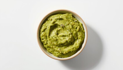 Obraz premium Avocado guacamole served on white background captured from top view