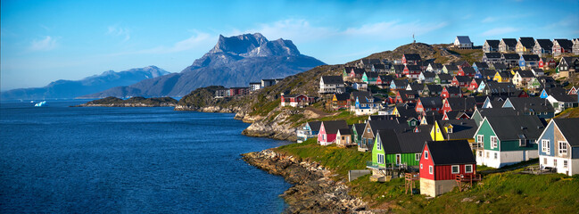 Colorful houses of Nuuk, Greenland with Mt. Sermitsiaq in the background. © Greg Larson