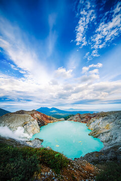 Ijen Crater Acidic Turquoise Lake and Sulfur Smoke Plume at Sunrise East Java