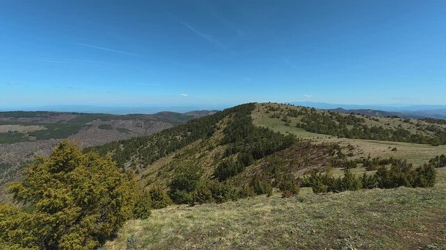 Clear sky above rolling green hills. Mount Goc, Ljukten peak. Balkans, Serbia