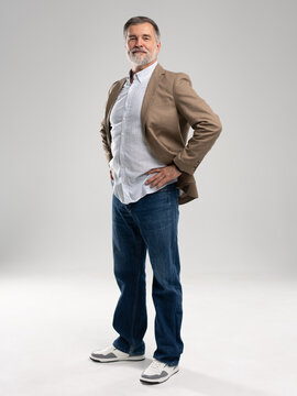 Entrepreneur in jacket smiling, Happy mid adult, mature age man standing, smiling, isolated on white background