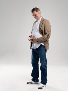 Smiling mature man posing isolated on white background