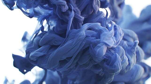 Dense clouds of vibrant blue ink swirling and dissolving in water isolated on a white