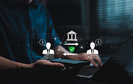 Digital banking and secure transaction concept. Safe online payment system. Businessman using smartphone. Peer to peer money transfer with icon of bank building, user profiles, shield, financial data