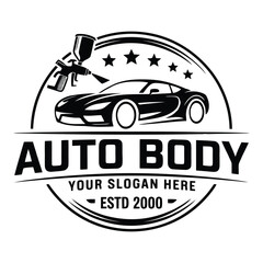 Obraz premium Black and white of auto body shop with spray gun and sports car