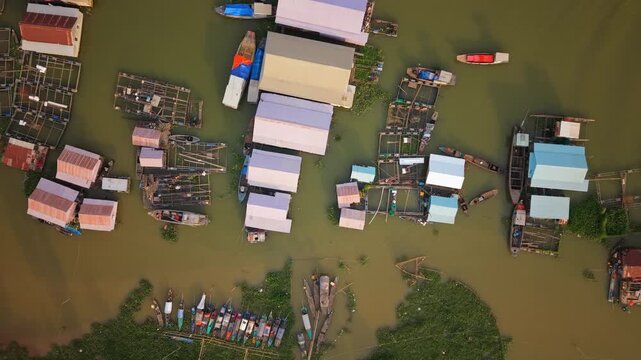 Top-down aerial of floating houses and fish cages, Chau Doc, Vietnam