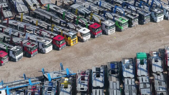 Auto hauler trucks parked, aerial view