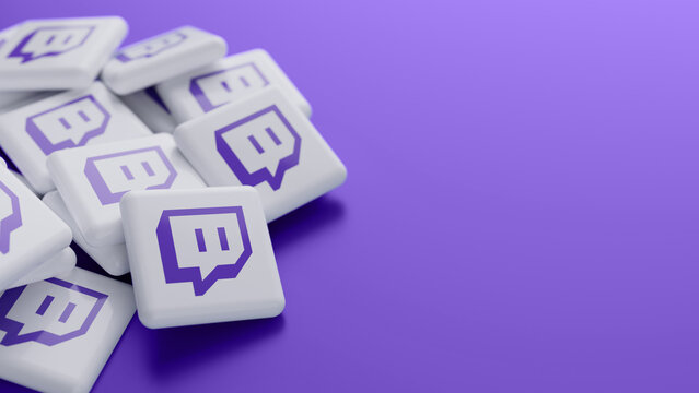 Berlin, Germany - May 19, 2026: Close-up of the Twitch logo in a pile on purple background with copy space