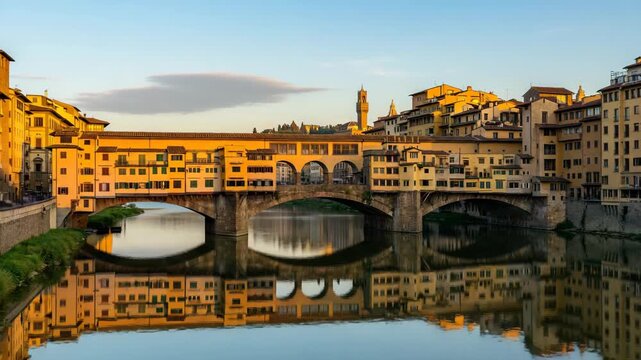 golden sunlight on ponte vecchio spanning arno river florence timelapse video