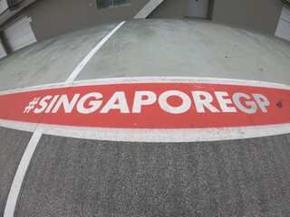 Obraz premium Singapore / December 2017: Pit lane and start finish line of the Formula One Racing track at Marina Bay Street Circuit. 