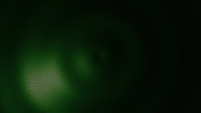 Digital green geometric mesh background glowing from a central focal point in a virtual cybernetic space with dark industrial aesthetic and high contrast spotlighting