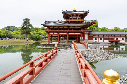 Exterior of Byodo-in Buddhist Temple, Uji, Japan, with bridge leading to the temple