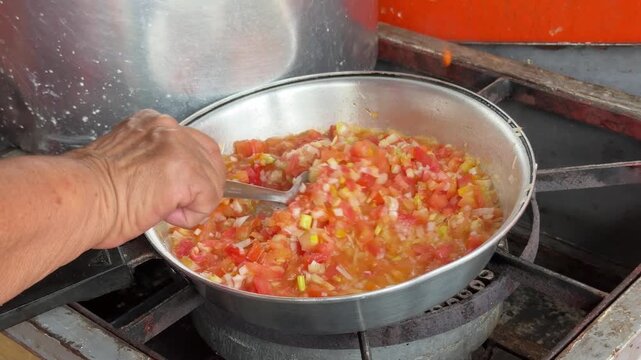 Cooking Tomato Onion Salsa for Patacones Con Hogao