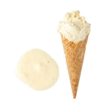 Vanilla soft ice cream in baked waffle cone flying isolated on white. Fresh creamy ice cream with natural vanilla is frozen summer dessert.