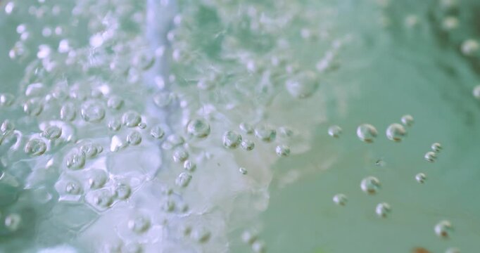 Oxygen bubbles in an aquarium, representing aquatic life, water filtration, fish tank environment, freshness, and abstract underwater motion, close-up