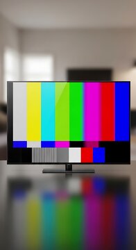 Modern Television Displaying Color Test Pattern in Blurred Living Room
