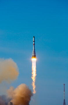 Take-off of a real launch vehicle from a spaceport. A rocket takes off into the sky against a background of clouds. Startup concept, power of science and technology.