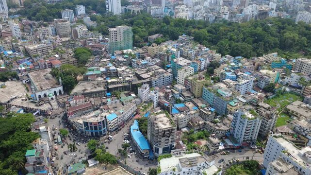 The aerial view of Chattogram city highlights the rapid urban expansion surrounding its remaining green hills and forests. Unplanned construction, hill cutting, and the destruction of trees.