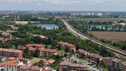 Obraz premium Aerial View of a Suburban Landscape with Train Tracks. Poasco, Milan, Italy.