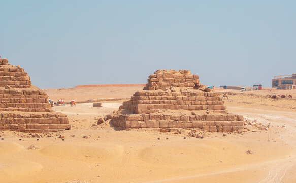 The Giza Pyramids in Cairo, Egypt, panoramic view. General view of the pyramids from the Giza plateau. Three pyramids, known as the Queen's Pyramids, are on the front.