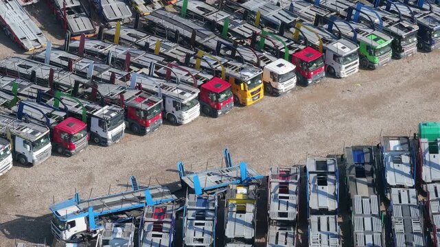Auto hauler trucks parked, aerial view