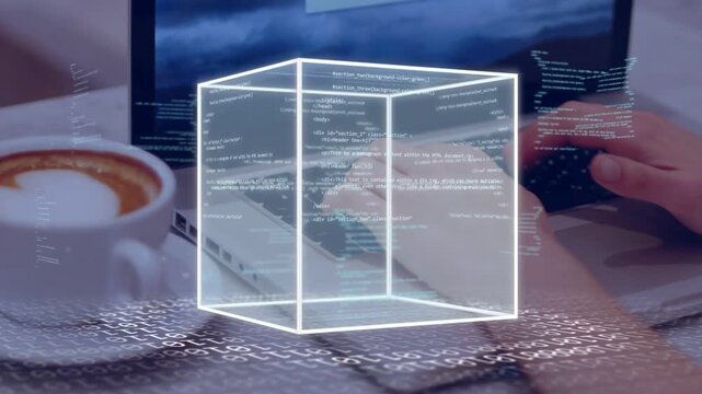 Hands typing initiating wireframe cube forming and rotating over laptop, coffee left, code showing