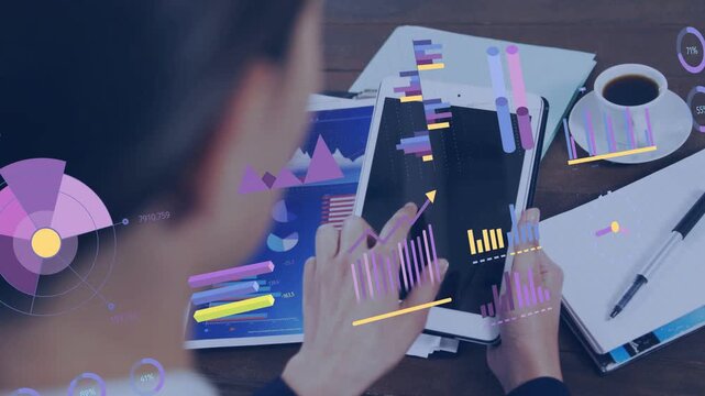 Business analyst woman tapping and swiping tablet at desk, animating charts for data analysis