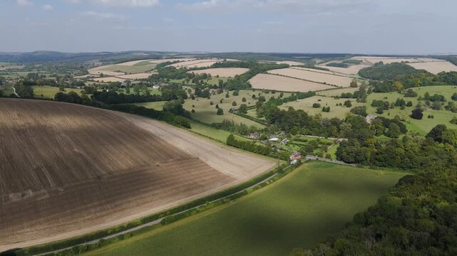 4K spectacular sweeping aerial view over rolling Dorset countryside.