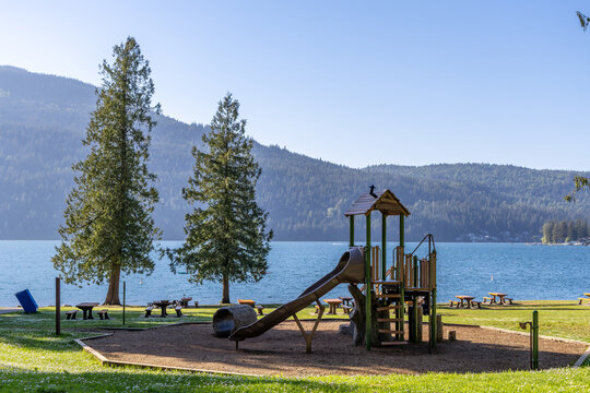 Playground by Cultus Lake Waterfront Park With Mountains Trees and Picnic Areas in Chilliwack BC Canada