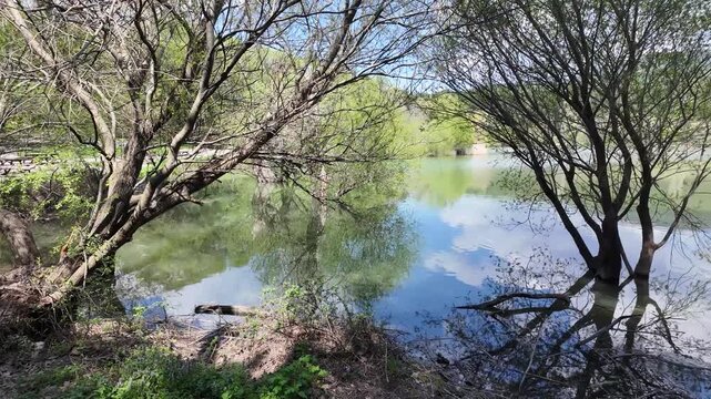 Scenic View of Karagol Nature Park Lake with Picnic Tables and Lush Trees in Izmir, Turkey. High quality 4k footage