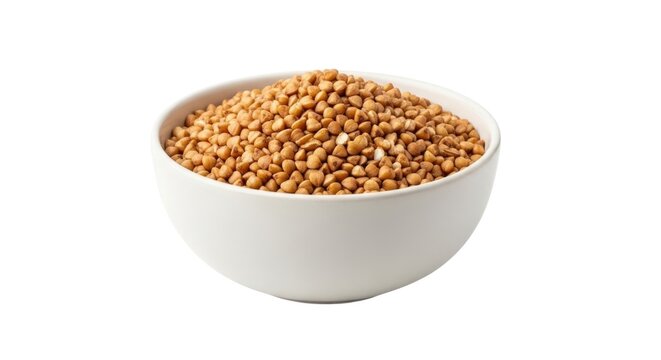 Bowl of buckwheat kernels isolated on white background