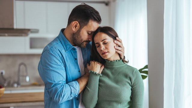 Tender Moment of a Couple Embracing at Home Showing Comfort, Support and Quiet Affection