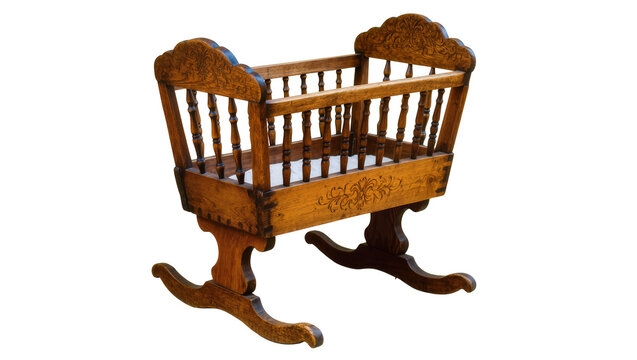 Antique wooden rocking cradle with ornate carvings, isolated on transparent background