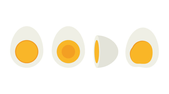 An image showing four halved eggs with exposed yolks on a plate indoors.