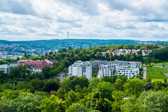Germany, Stuttgart TV tower rising above Killesberg residential rooftops on clear summer day
