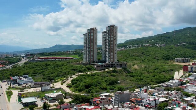 Aerial view of modern residential twin towers apartment skyscrapers in growing city
