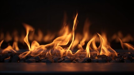 Fototapeta premium Flames dance gently with warm amber tones against a dark background, creating a cozy atmosphere