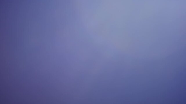 Violet-tinted leak overlay with edge glow, producing a soft veiling flare effect for transitions or highlights