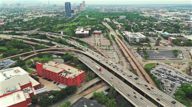 Drone tilt from Houston Texas urban sprawl into a complex freeway junction