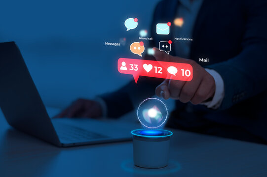Digital notifications concept with glowing AI assistant icon on laptop keyboard in dark setting
