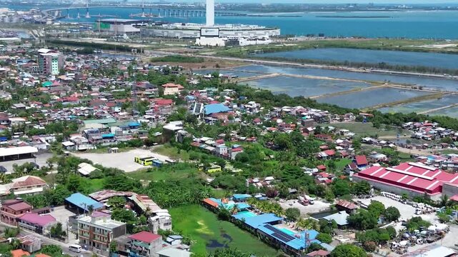 Aerial footage of urban residential environment and tightly packed buildings in Cebu City Philippines.